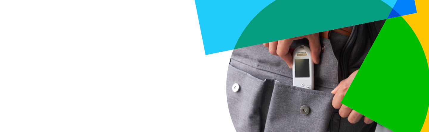 A person placing a glucose meter into the pocket of a gray jacket, demonstrating portability and convenience.